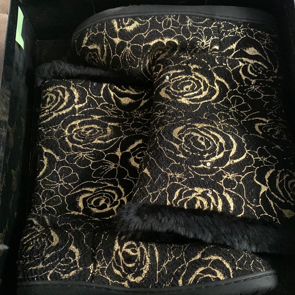 Unique black slip on boots with gold accents
